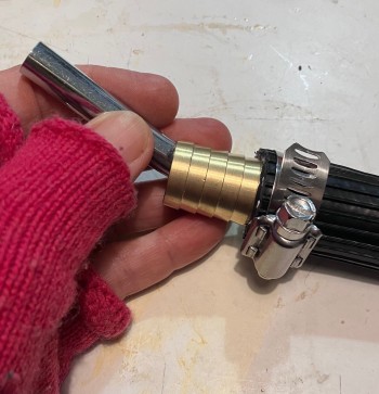 a hand piecing Shoogly Holm parts together